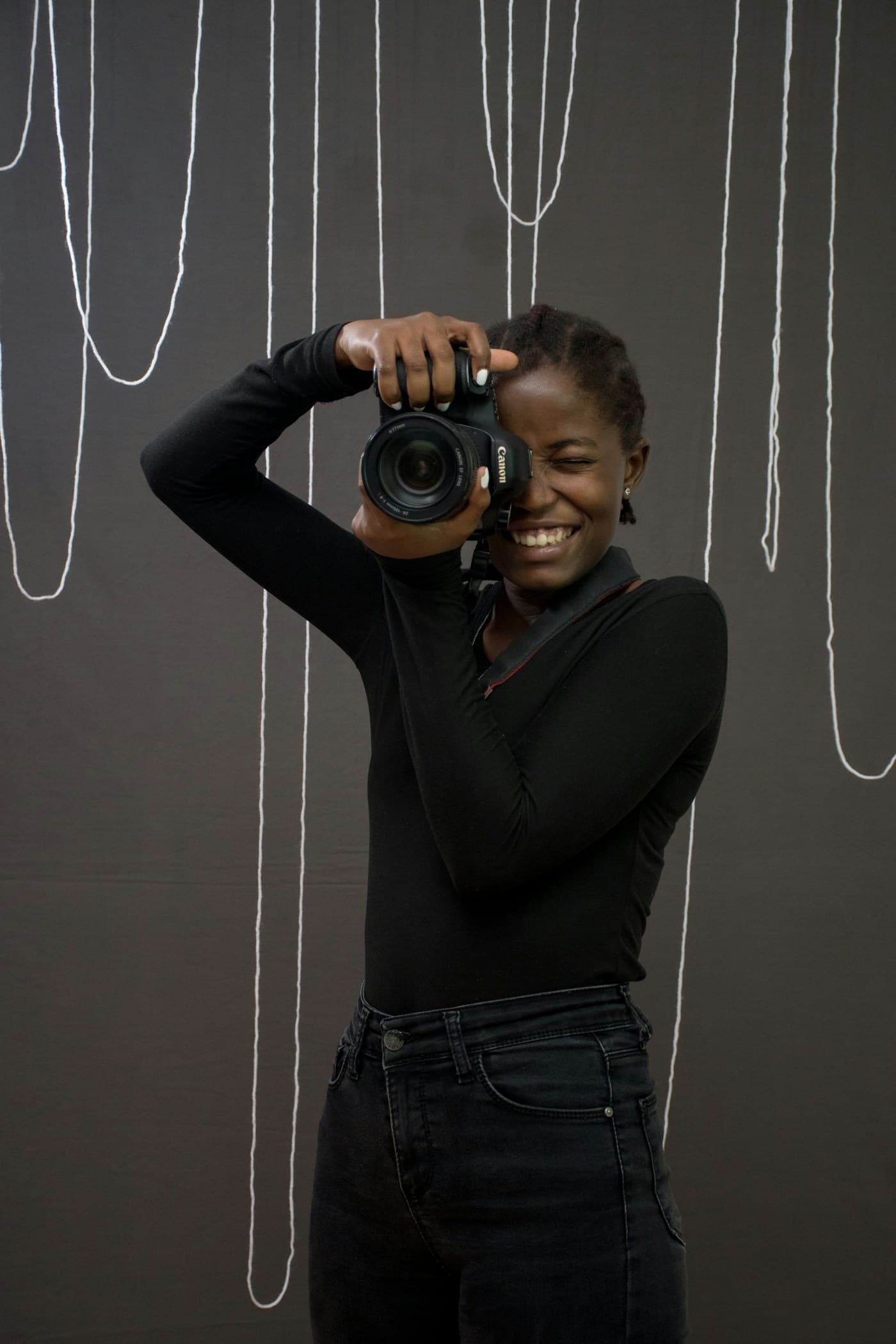 Photographer holding a camera up to her eye